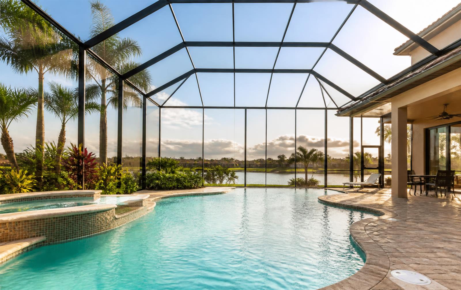 Aluminum pool cage with new screen over a pool in Central Florida